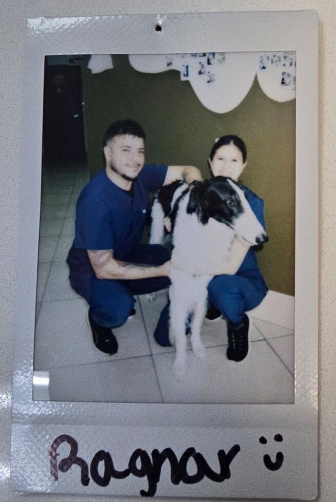 two people one dog smiling