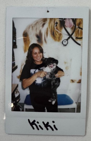 woman holding small dog