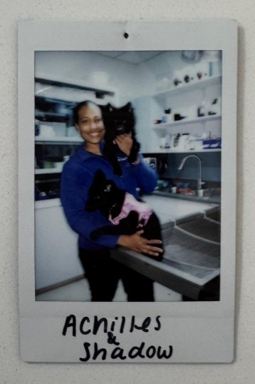 woman holding two dogs